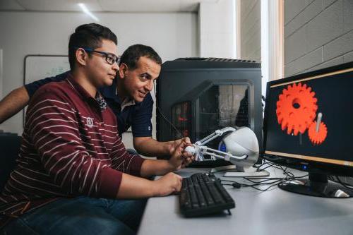 A faculty member and graduate student perform tests in the haptics lab in computer engineering.